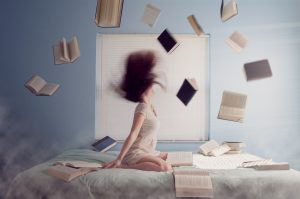 a woman filled with anger throws books