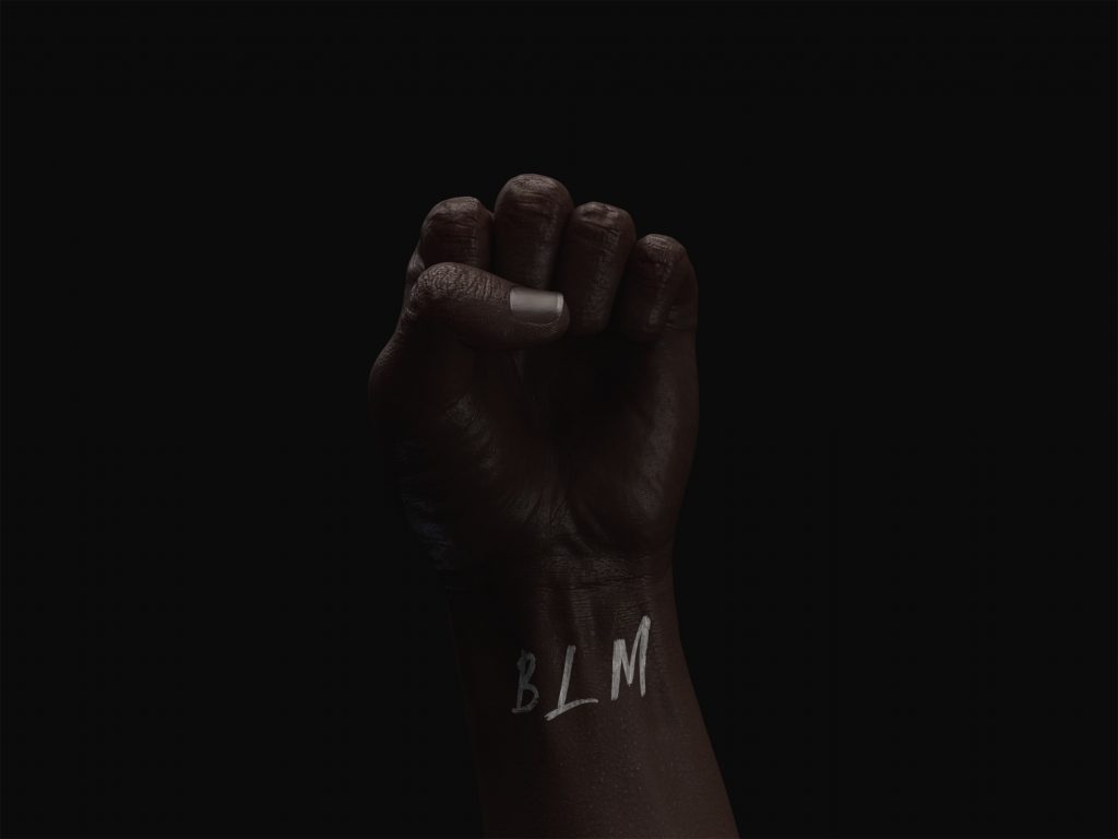 Cloased fist with BML written on the wrist